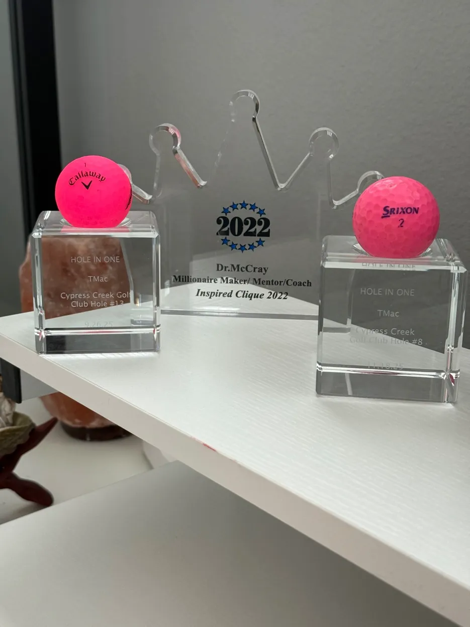 Two hole-in-one trophies and Millionaire Maker award